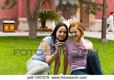 Stock Photograph - Tourists watching pictures in their camera, The Forbidden City, Beijing, China, Asia MR. Fotosearch