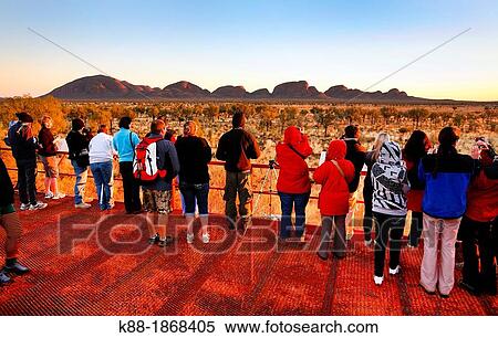 Tourists watching sunrise over Kata Tjuta the Olgas, Central Australia View Large Photo Image Stock Photography - Tourists watching sunrise over Kata Tjuta the Olgas, Central Australia. Fotosearch