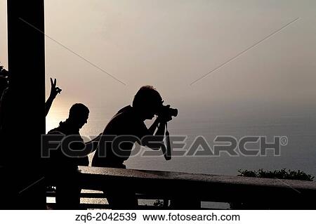 Toursits watching Sunset on Phuket, Thailand View Large Photo Image Stock Photo - Toursits watching Sunset on Phuket, Thailand. Fotosearch