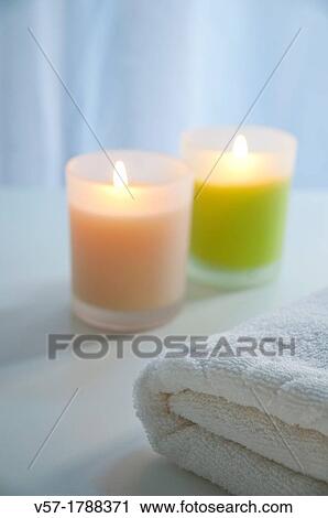 Stock Image - Towel and two candles. Fotosearch
