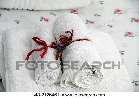 Stock Image - towels on hotel bed.. Fotosearch