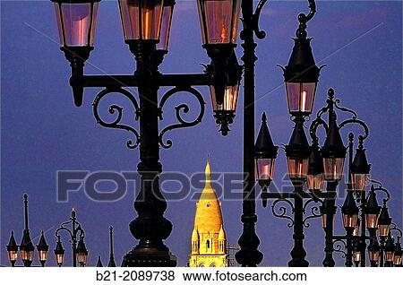 Tower of Sainte Marie de la Bastide church and lamps on the Pont de Pierre (Stone Bridge), Bordeaux, Gironde, Aquitaine, France View Large Photo Image Stock Photo - Tower of Sainte Marie de la Bastide church and lamps on the Pont de Pierre (Stone Bridge), Bordeaux, Gironde, Aquitaine, France. Fotosearch