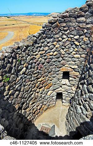 Stock Photography - Tower. Unesco World Heritage Site. 14 century BC. Nuraghe Su Nuraxi. Barumini. La Marmilla Region. Sardinia. Italy.. Fotosearch