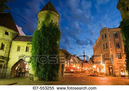 Stock Photography - Towers of Viru Gate, cobble stone streets and Town Hall Raekoda at night in Old Town. Tallinn. Estonia. Fotosearch