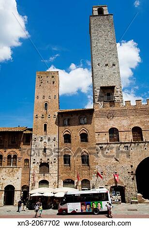 Stock Image - Towers, Piazza del Duomo, Cathedral Square, San Gimignano, UNESCO World Heritage, Siena province, Tuscany, Italy, Europe.. Fotosearch