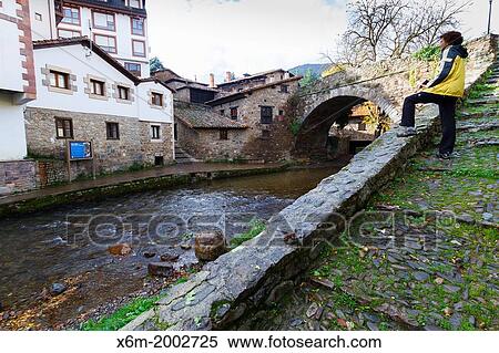 Stock Photography - Town and Quiviesa river. Potes, Comarca de Li? bana, Cantabria, Spain.. Fotosearch