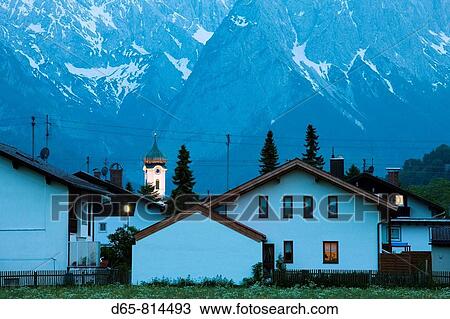 Town and Wetterstein Mountains in the evening, Farchant, Bavaria, Germany View Large Photo Image Stock Image - Town and Wetterstein Mountains in the evening, Farchant, Bavaria, Germany. Fotosearch