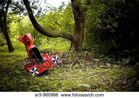 Toy replica airplane nose dives into green forest View Large Photo Image Stock Photograph - Toy replica airplane nose dives into green forest. Fotosearch