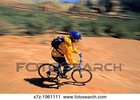 Tracey Weber mountain biking red rock on the Broken Arrow Trail near the city of Sedona in Arizona. View Large Photo Image Stock Image - Tracey Weber mountain biking red rock on the Broken Arrow Trail near the city of Sedona in Arizona.. Fotosearch