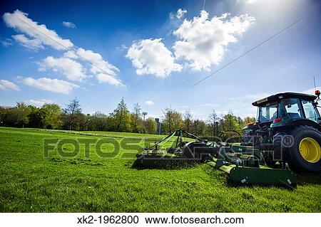 Tractor mowing in king george's park, southfields, near wimbledon, London, UK View Large Photo Image Stock Image - Tractor mowing in king george's park, southfields, near wimbledon, London, UK. Fotosearch