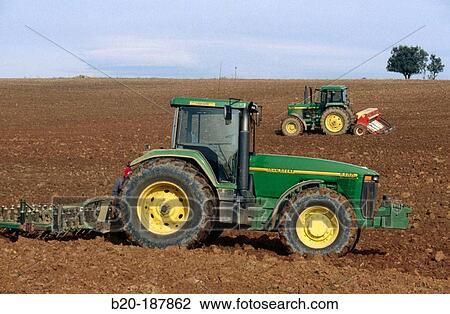 Tractor ploughing field. Spain View Large Photo Image Stock Image - Tractor ploughing field. Spain. Fotosearch