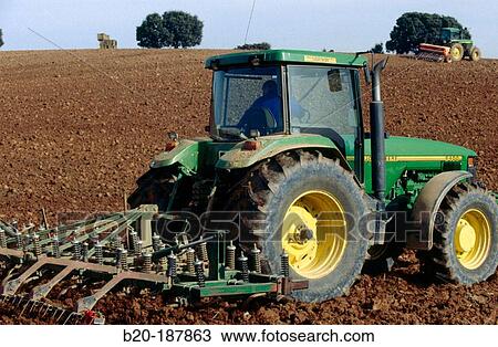 Tractor ploughing field. Spain View Large Photo Image Stock Image - Tractor ploughing field. Spain. Fotosearch