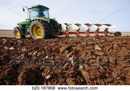 Tractor ploughing field. Spain View Large Photo Image Stock Photo - Tractor ploughing field. Spain. Fotosearch