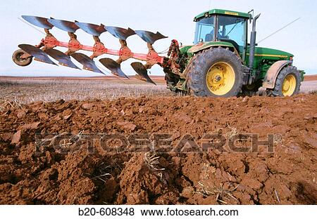 Tractor ploughing field. Spain View Large Photo Image Stock Photo - Tractor ploughing field. Spain. Fotosearch