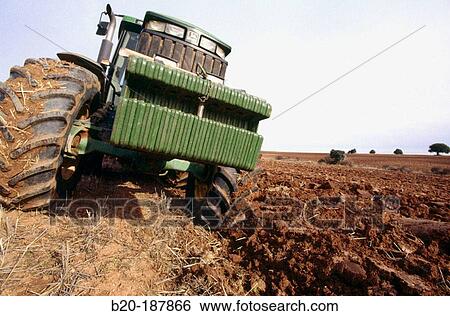 Tractor ploughing field. Spain View Large Photo Image Stock Photograph - Tractor ploughing field. Spain. Fotosearch