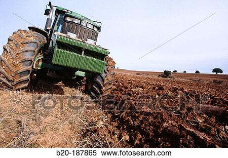 Tractor ploughing field. Spain View Large Photo Image Stock Photography - Tractor ploughing field. Spain. Fotosearch