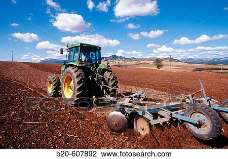 Tractor ploughing. Navarre. Spain View Large Photo Image Stock Image - Tractor ploughing. Navarre. Spain. Fotosearch