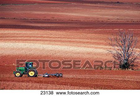 Stock Photo - Tractor ploughing. Navarre. Spain. Fotosearch