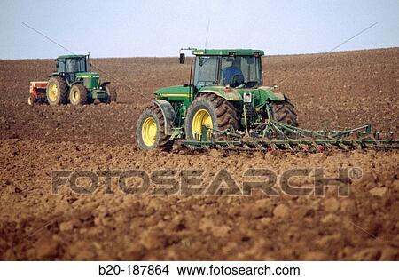 Tractors ploughing field. Spain View Large Photo Image Picture - Tractors ploughing field. Spain. Fotosearch