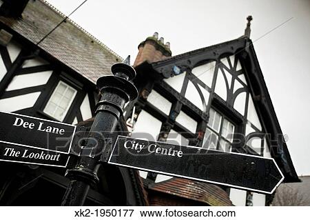 Traditional architecture and street sign "City Centre" in Chester, UK View Large Photo Image Stock Photo - Traditional architecture and street sign "City Centre" in Chester, UK. Fotosearch