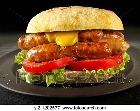 Traditional chipolatta pork sausages with mustard sandwich View Large Photo Image Stock Photo - Traditional chipolatta pork sausages with mustard sandwich. Fotosearch