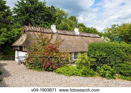 Traditional cottage with thatched roof in Unewatt, Schleswig-Holstein, Germany, Europe View Large Photo Image Stock Image - Traditional cottage with thatched roof in Unewatt, Schleswig-Holstein, Germany, Europe. Fotosearch