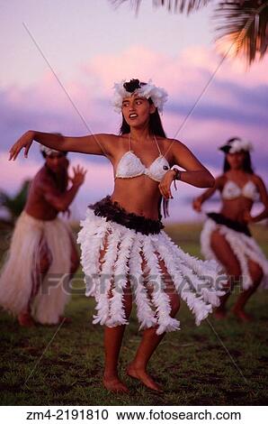 Stock Image - Traditional dances on Easter Island at sunset.. Fotosearch