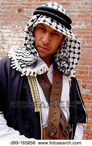 Traditional dressed Palestinian man looking directly down at camera View Large Photo Image Stock Photograph - Traditional dressed Palestinian man looking directly down at camera. Fotosearch