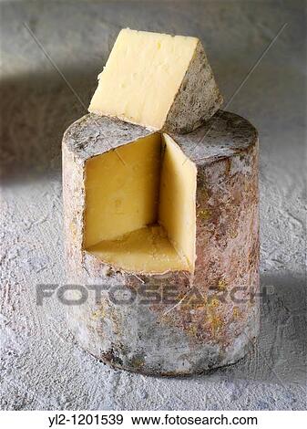 Traditional Farmhouse Cheddar cheese truckle View Large Photo Image Stock Photo - Traditional Farmhouse Cheddar cheese truckle. Fotosearch