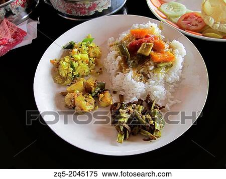 Traditional food of boiled rice and a host of side-dishes on houseboat, Kerala, India. View Large Photo Image Stock Photography - Traditional food of boiled rice and a host of side-dishes on houseboat, Kerala, India.. Fotosearch