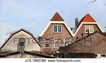 Stock Photo - Traditional house facades in Amsterdam, The Nederlands. Fotosearch