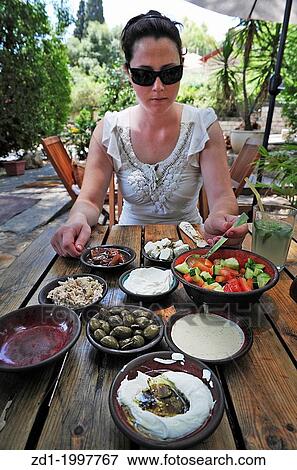 Traditional Israeli breakfast in a restaurant in Rosh Pinna town located in the Upper Galilee on the Northern District of Israel. View Large Photo Image Stock Photo - Traditional Israeli breakfast in a restaurant in Rosh Pinna town located in the Upper Galilee on the Northern District of Israel.. Fotosearch