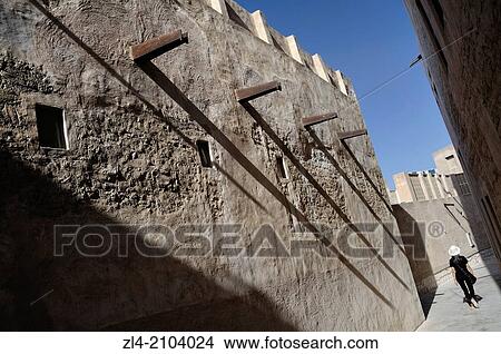 Traditional narrow street. United Arab Emirates, UAE, Dubai, Al Fahidi Historical Neighbourhood. Model Released. View Large Photo Image Picture - Traditional narrow street. United Arab Emirates, UAE, Dubai, Al Fahidi Historical Neighbourhood. Model Released.. Fotosearch