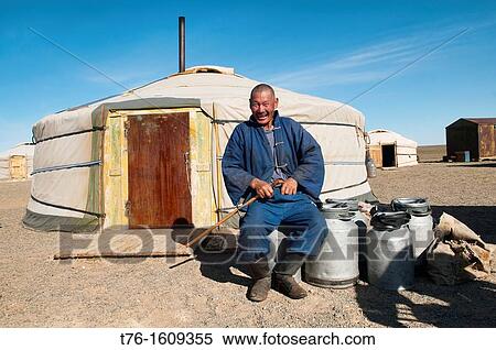 traditional nomad sitting outside his ger in the Gobi Desert of Mongolia View Large Photo Image Stock Photography - traditional nomad sitting outside his ger in the Gobi Desert of Mongolia. Fotosearch