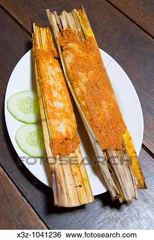Traditional nyonya fish cakes called otak otak cooked in bamboo View Large Photo Image Stock Photograph - Traditional nyonya fish cakes called otak otak cooked in bamboo. Fotosearch