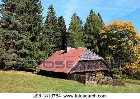 Picture - traditional old farmhouse at the village Srni, German: Rehberg, Bohemian Forest, National Park Sumava, Czech Republic, Europe. Fotosearch
