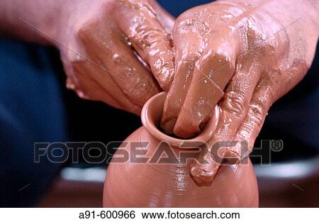 Stock Photograph - Traditional potter at work. Okinawa. Japan. Fotosearch