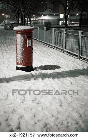 Traditional red english postbox at winter time snow View Large Photo Image Stock Photo - Traditional red english postbox at winter time snow. Fotosearch
