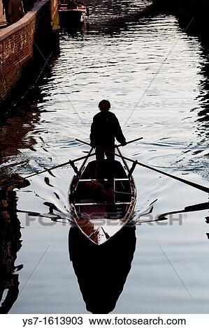Traditional rowing boat along a Venice canal, Venice, Italy, Europe View Large Photo Image Stock Image - Traditional rowing boat along a Venice canal, Venice, Italy, Europe. Fotosearch