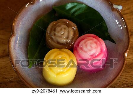 Traditional Thai Coconut jelly is prepared from coconut milk, sugar and gelatin. While gelatin is dissolved in water, coconut milk is brought to a simmer. View Large Photo Image Stock Image - Traditional Thai Coconut jelly is prepared from coconut milk, sugar and gelatin. While gelatin is dissolved in water, coconut milk is brought to a simmer.. Fotosearch