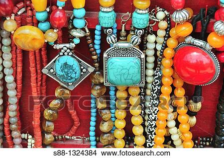Traditional Tibetan accessories for sale on the street. Mcleod ganj, Dharamshala, Himachal Pradesh, India. View Large Photo Image Picture - Traditional Tibetan accessories for sale on the street. Mcleod ganj, Dharamshala, Himachal Pradesh, India.. Fotosearch