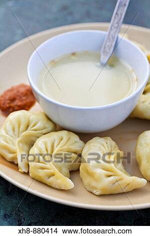 Picture - Traditional Tibetian momo meal and bananna, Darjeeling, West Bengal, India. Fotosearch