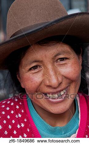 Traditional woman in dress and hat in small town of Pisaq Peru View Large Photo Image Stock Photograph - Traditional woman in dress and hat in small town of Pisaq Peru. Fotosearch