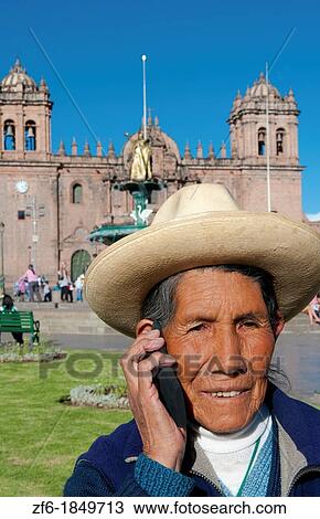 Traditional woman on cell phone communicating in Main Square in Cusco Cuzco Peru View Large Photo Image Stock Image - Traditional woman on cell phone communicating in Main Square in Cusco Cuzco Peru. Fotosearch