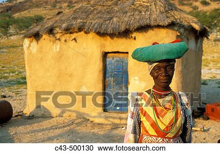 Traditionally dressed Herero woman at her house in the vicinity of Warmquelle, a village in the southern Kaokoveld. Namibia. View Large Photo Image Stock Image - Traditionally dressed Herero woman at her house in the vicinity of Warmquelle, a village in the southern Kaokoveld. Namibia.. Fotosearch