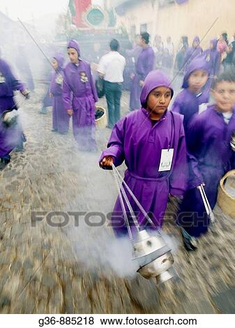 Stock Photo - Traditionally dressed men and boys for Easter procession, Antigua, Sacatepequez, Guatemala. Fotosearch