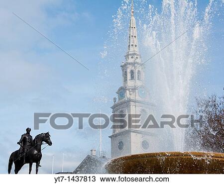 Trafalgar square fountain with Martin in the field seen in the background London View Large Photo Image Stock Image - Trafalgar square fountain with Martin in the field seen in the background London. Fotosearch
