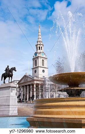 Stock Image - Trafalgar square fountain with St Martin's in the Field, London, UK. Fotosearch