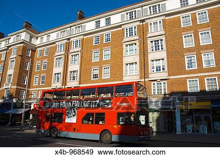 Traffic along Kensington High Street West London England UK View Large Photo Image Stock Photo - Traffic along Kensington High Street West London England UK. Fotosearch