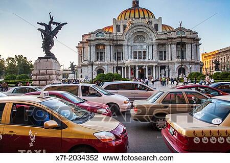 Stock Image - Traffic and Palacio de Bellas Artes, Mexico City, Mexico.. Fotosearch